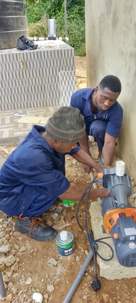 Team working on a water pump installation