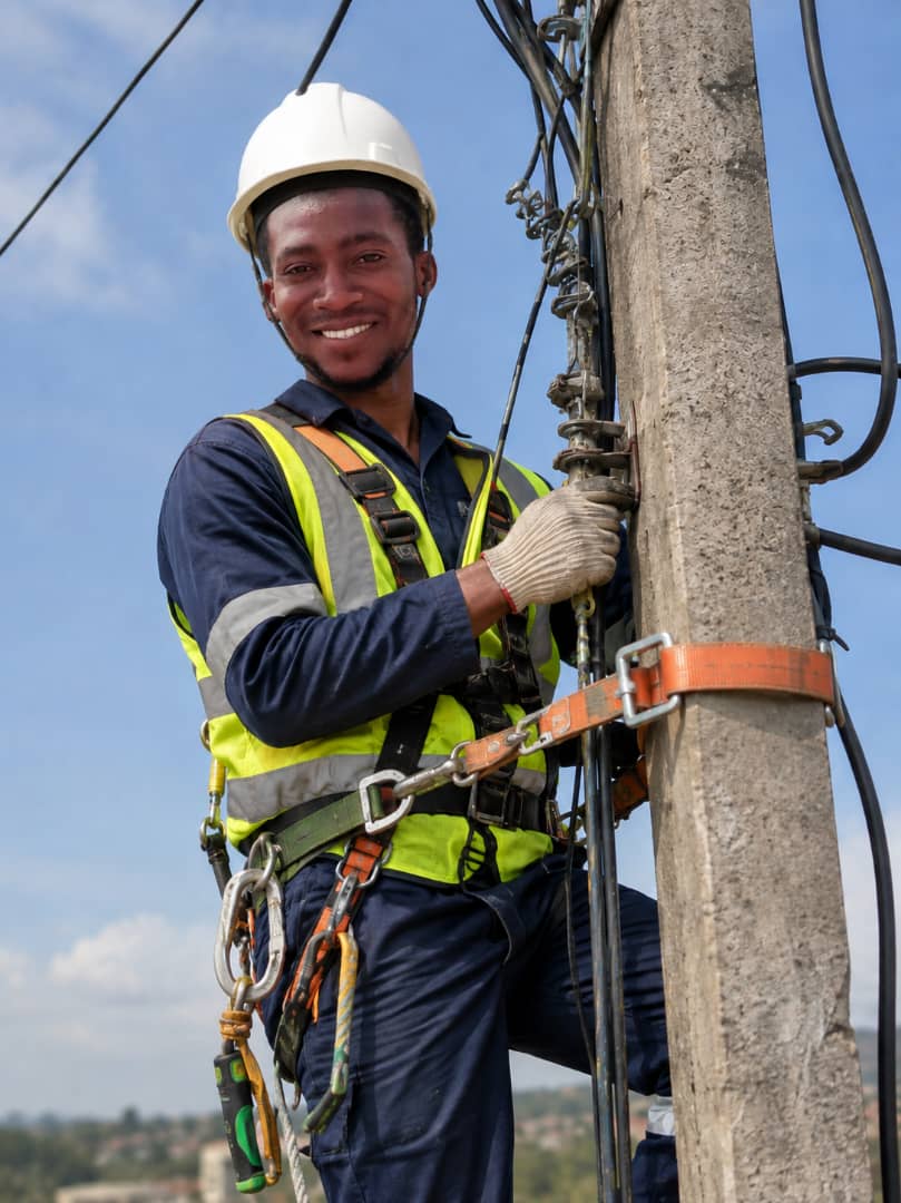 Electrical technician at a utility pole