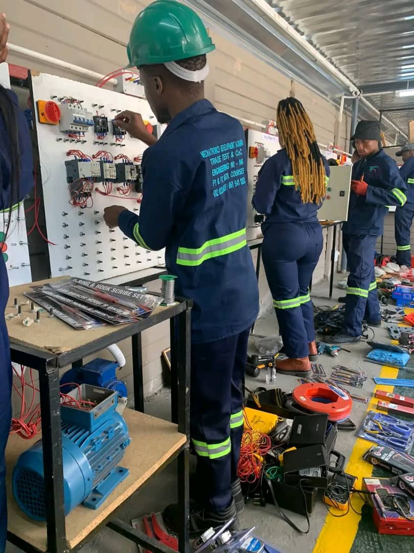 Technicians working with electrical equipment